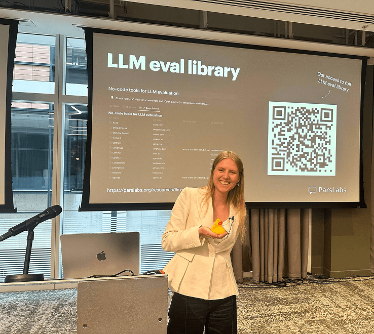 Lena presenting the LLM eval library at a conference talk